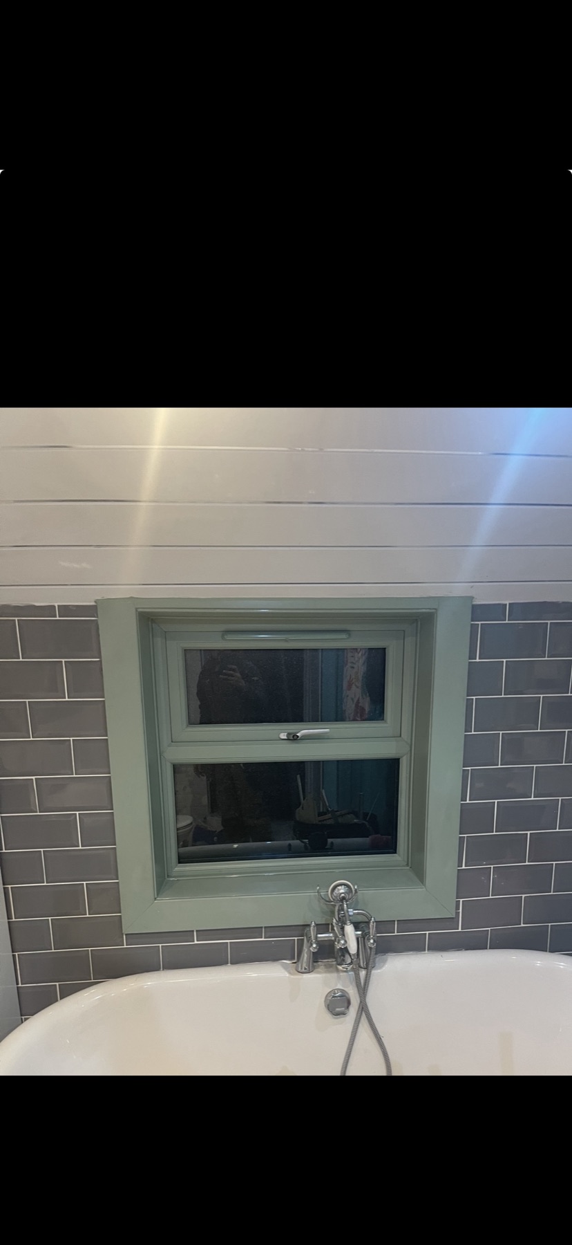 Coloured double glazed window fitted over bath
